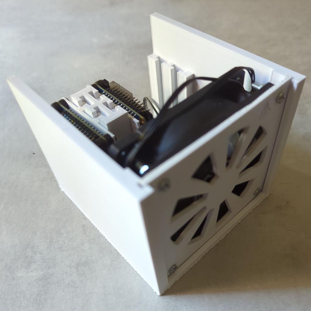 Front view of a white 3D printed Pi cluster chassis.
